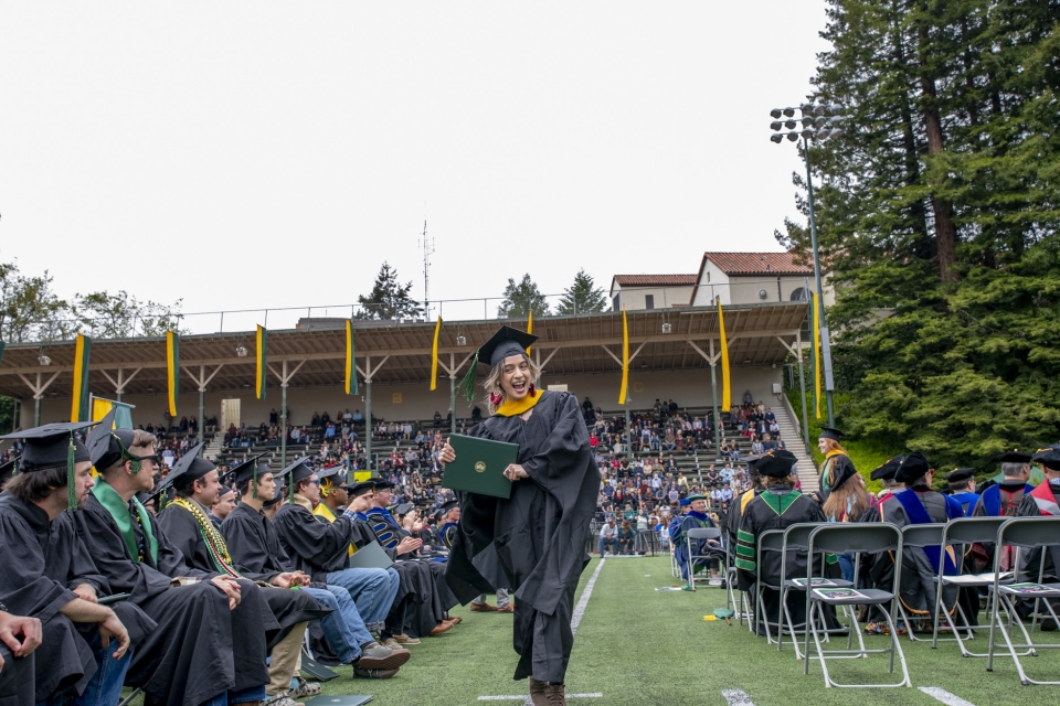 graduate student receiving her diploma